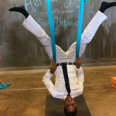 Anyone can do aerial yoga! Even in a suit!